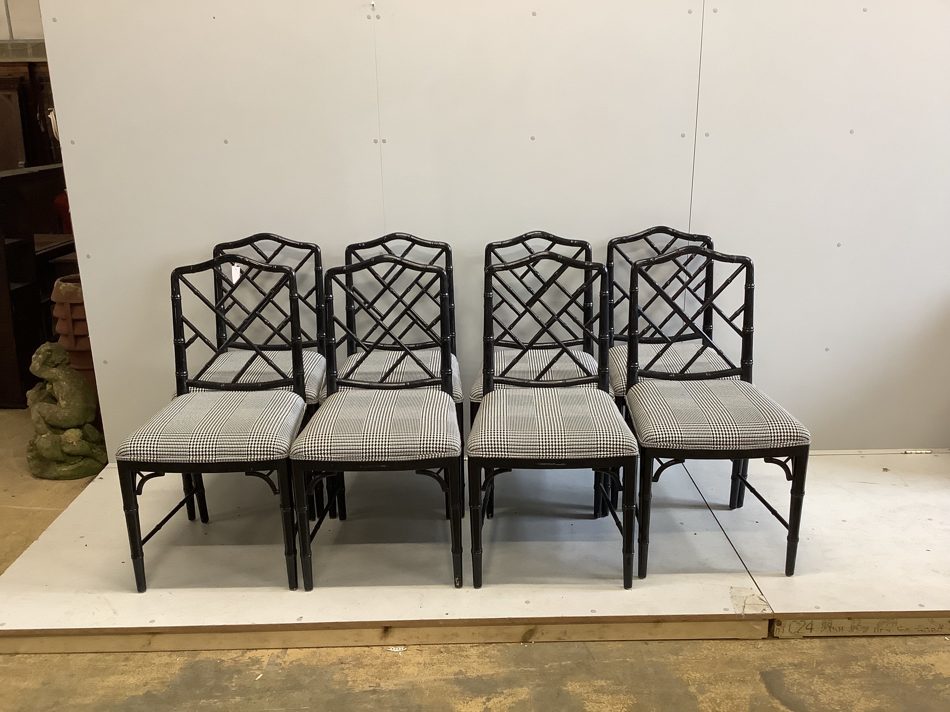 A set of eight reproduction ebonised faux bamboo dining chairs